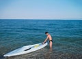 Cirali, Turkey, September, 2014 Ã¢â¬â Teenager boy with cayak boat on the sea Royalty Free Stock Photo